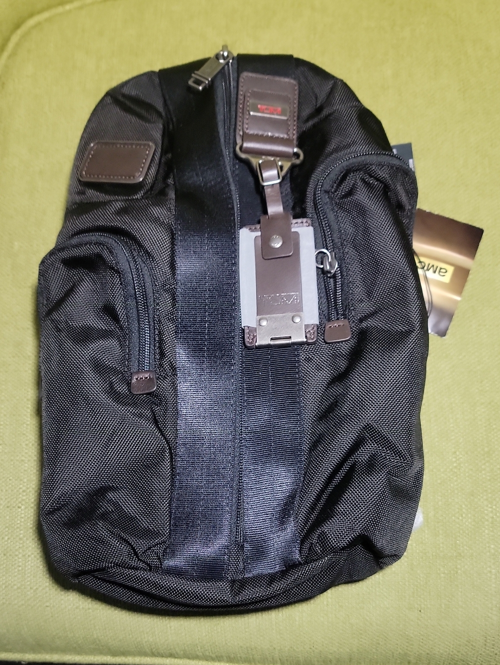 Tumi Black Nylon Sling Bag with Brown Leather Accents